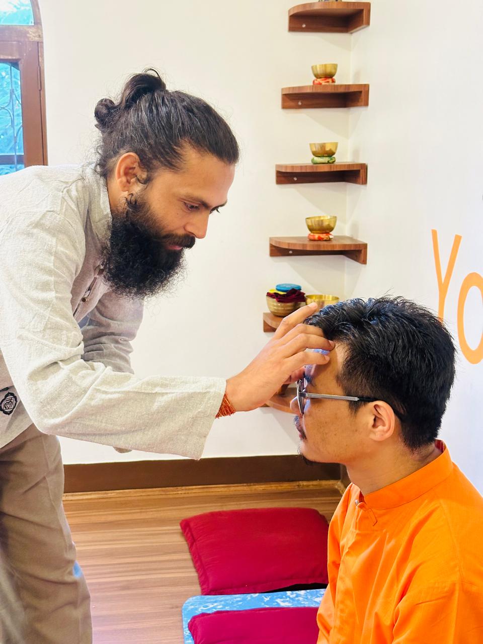 Traditional tilak blessing ceremony in the guru-shishya yoga tradition at Yogmandu, Kathmandu